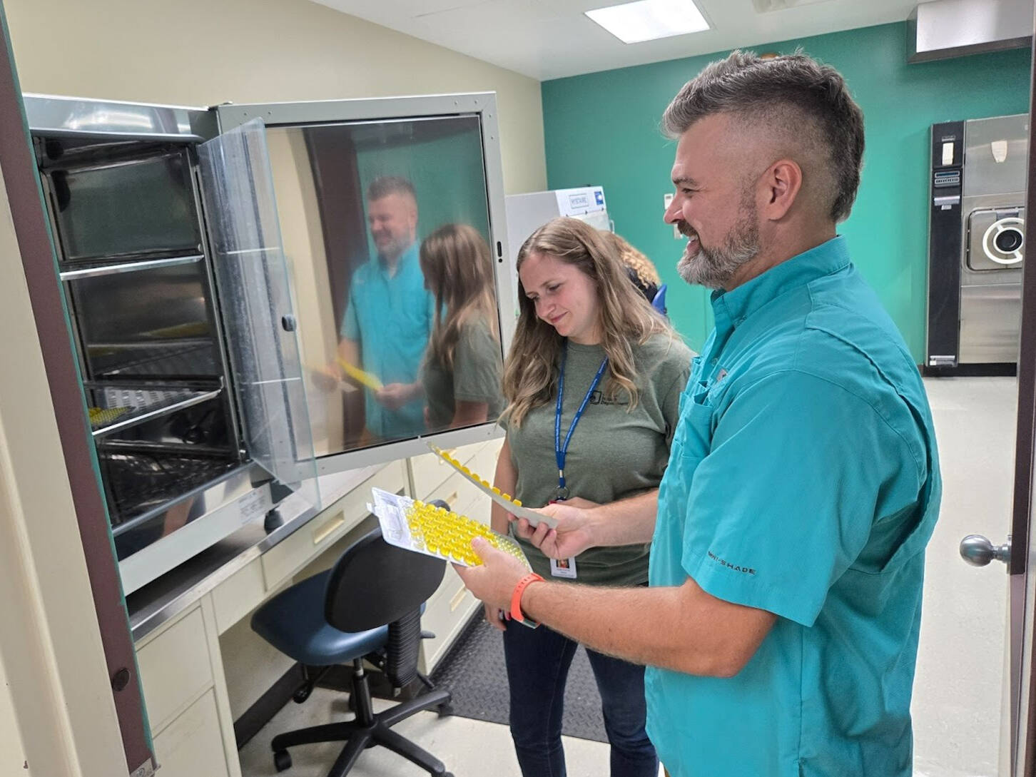 An MPH student works with his practicum supervisor at the Kent County Health Department.